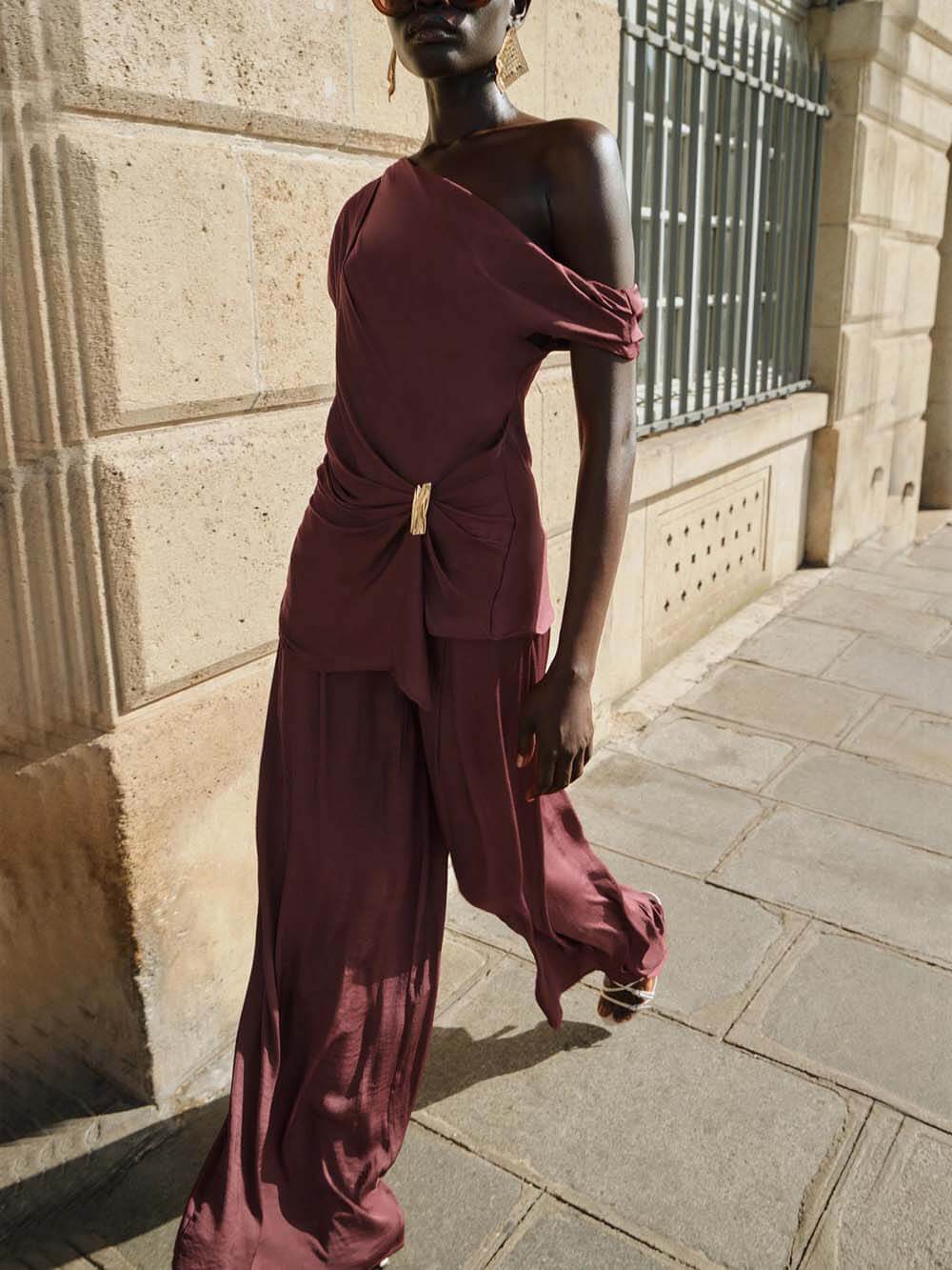 Unique Asymmetric Hem Metallic Accents Top